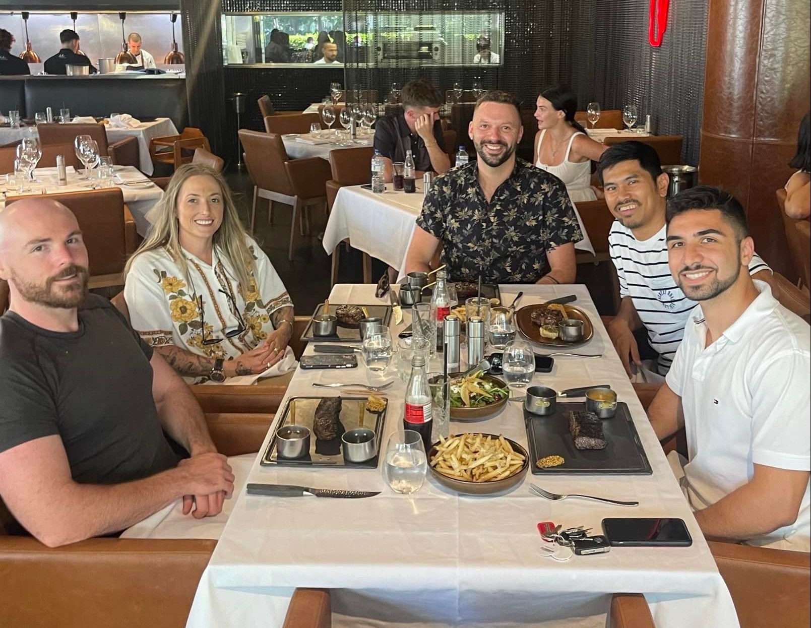 Patrick Galang with clients at a team dinner